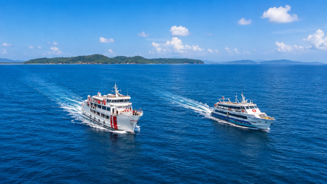 Aerial view of two Green Ocean ferries cruising the Andaman Sea